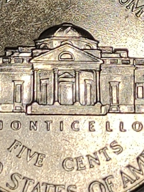 Close-up of Monticello steps on a 2009 Jefferson Nickel showing Full Steps designation with five unbroken horizontal lines